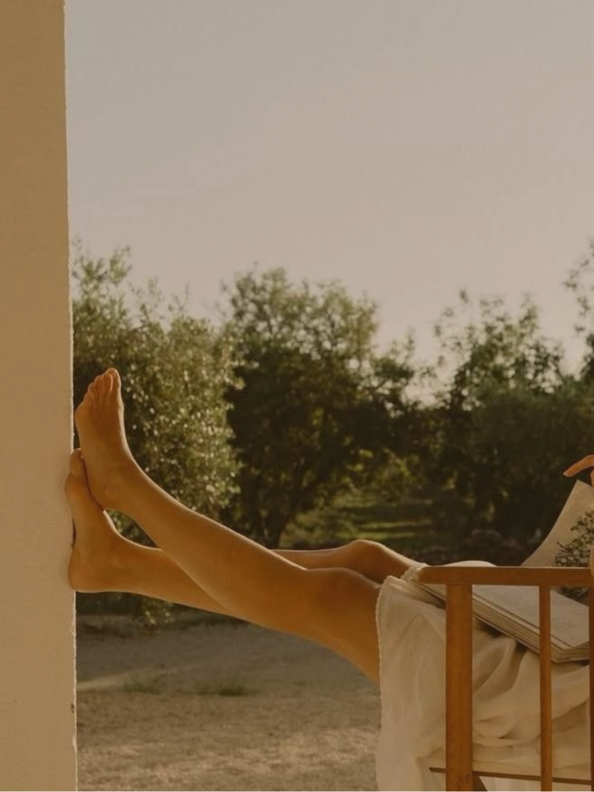 Legs resting on lounge chair